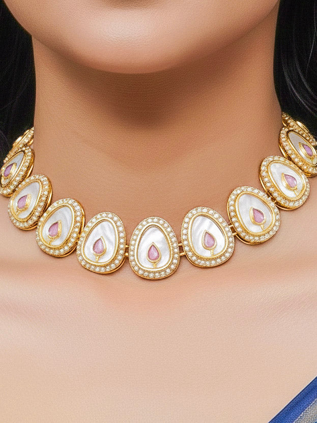 Close-up of a woman wearing an ornate traditional (Gold Polish) Mint Pink Collar Jewellery Set and Earrings with Mint Pink  Colored Stone and American Diamonds. Festive celebration look enhanced with sparkling artificial American Diamond jewelry. Saree look completed with elegant artificial American Diamond jewelry for festive occasions.