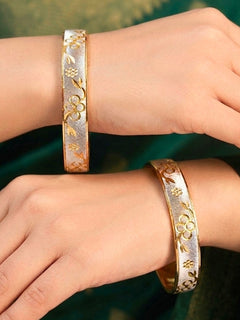 Close-up of an a women wearing ornate traditional (Gold Polish) Gold & Silver Bangles Set. It’s comfortable and lightweight enough for everyday wear, and it also looks absolutely beautiful and elegant. The design is stylish, the finish is impressive, and it feels really pleasant to wear all day. 