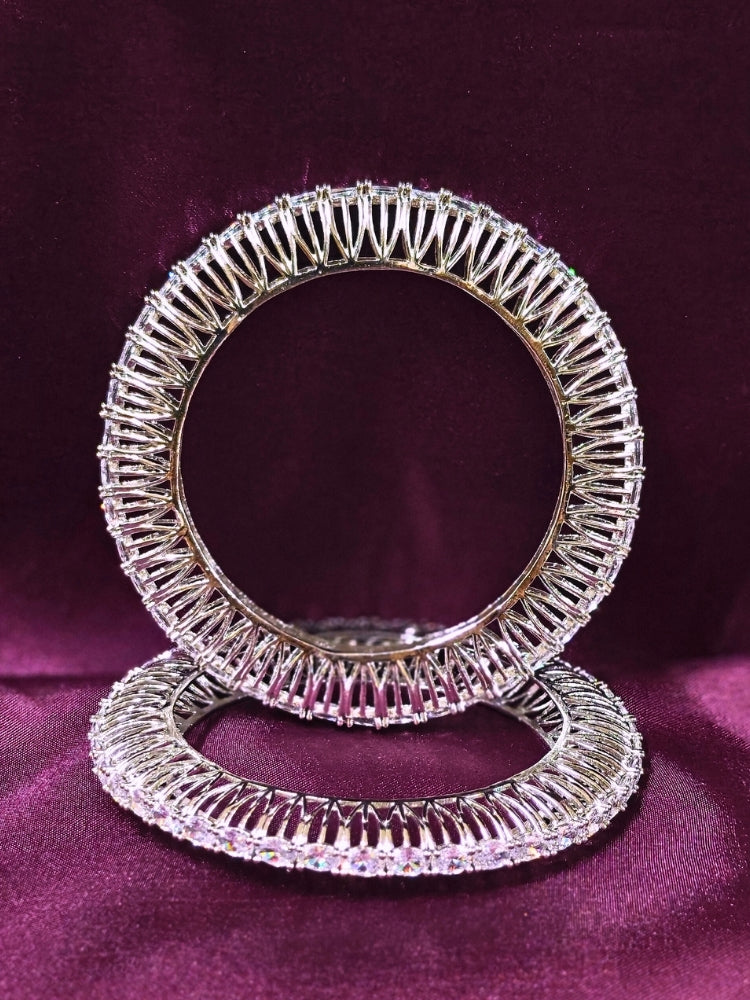 Close-up of an ornate Indo-western Silver Bangles with American Diamond. Wedding guest styling elegant artificial American Diamond bangles in India. Close-up of sparkling artificial American Diamond bangles for party wear. Luxury artificial American Diamond bangles styled for a wedding function.