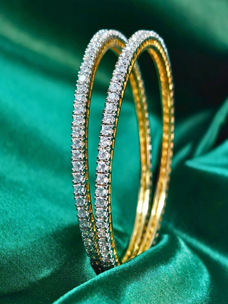 Close-up of an ornate Inod-Western (gold Polish) American Diamond Bangles Set. Elegant festive look with a high-quality imitation American diamond Bangles Set. Festive Diwali outfit styled with an American diamond artificial Bangles Set.