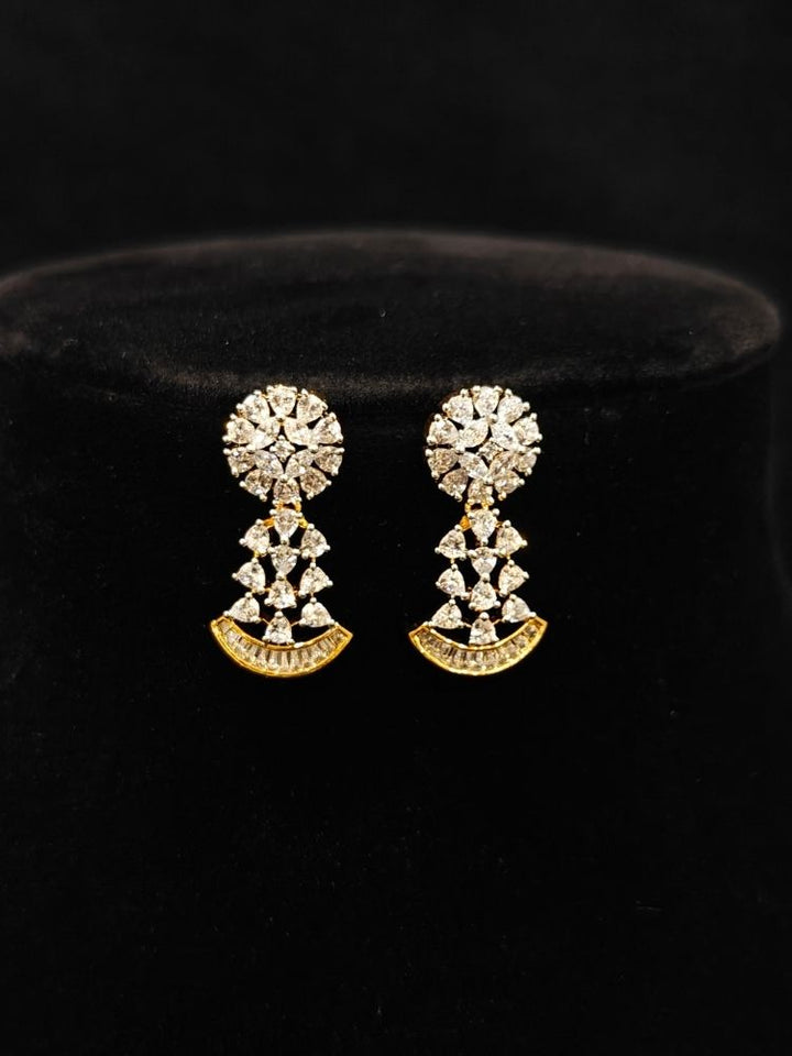 Close-up of  an ornate Western (Silver Polish) Collar jewellery set and earrings with American Diamond. Party wear outfit completed with a lightweight American diamond necklace. Reception-ready look featuring a American diamond jewelry set.