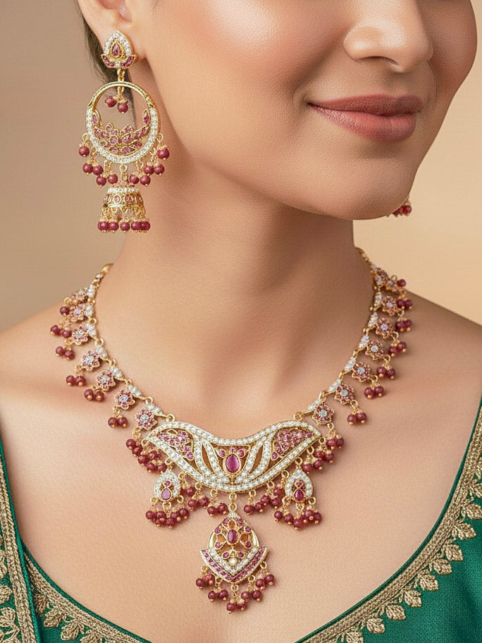 Close-up of a woman wearing an ornate traditional jadau gold jewellery set and jadau earrings with crystals beads and gemstones. Perfect Jadau necklace set for weddings and festivals. 
