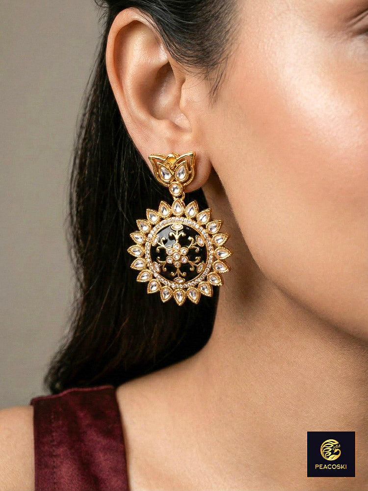 Close-up of a woman wearing an ornate traditional Black Rajwadi gold jewellery set and earrings with Black Colored Stones, Kundan, American Diamond. Festive Diwali outfit enhanced with a Rajwadi artificial necklace. Mehendi ceremony look styled with a Rajwadi artificial jewelry set.