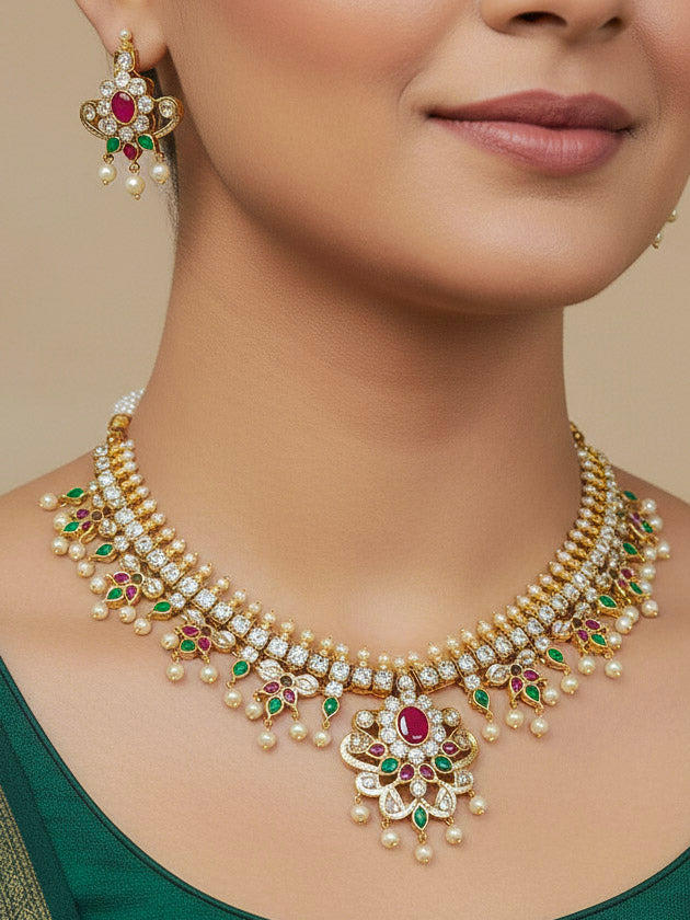 Woman wearing the Priyamvada Jadau gold collar necklace set with red and green stones