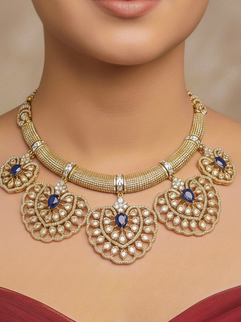 Close-up of a woman wearing an ornate Western American diamond Raizel Blue Necklace Set (Mehendi Polish) Collar jewellery set and earrings with Colored Stone and American Diamond. Reception-ready look featuring a statement American diamond jewelry set.