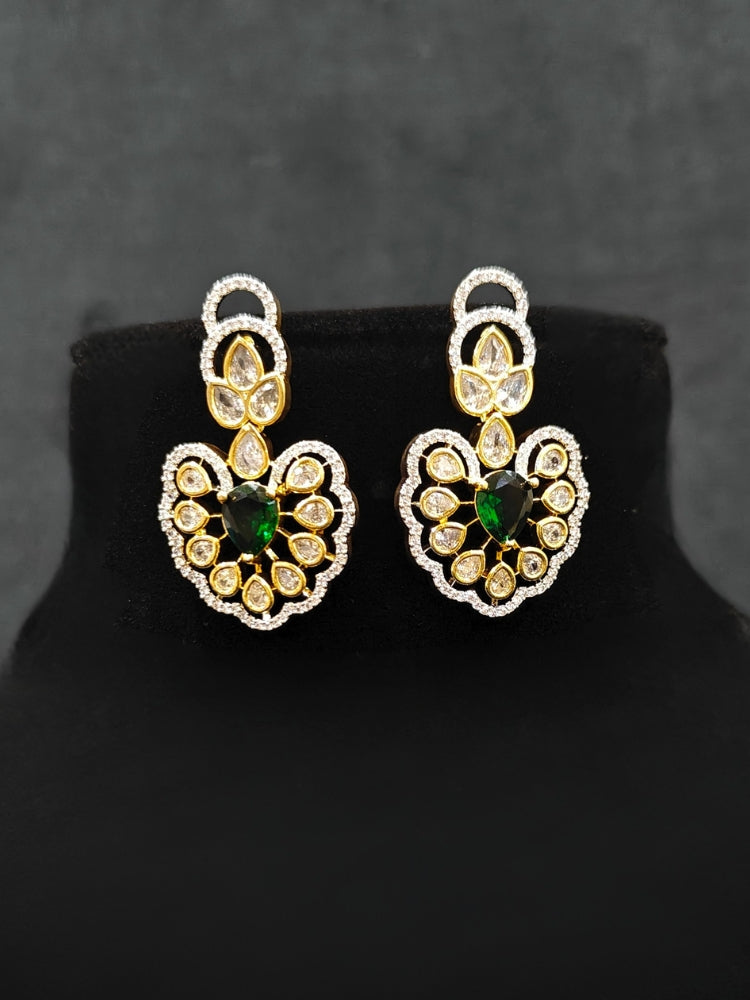 Close-up of an ornate Western American diamond Raizel Emerald Green Necklace Set (Dual Tone) Collar jewellery set and earrings with  Colored Stone and American Diamond. Bride-to-be styled in a premium American diamond artificial necklace for her reception party.