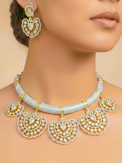Close-up of a woman wearing an ornate Western American diamond Raizel Necklace Set (Dual Tone) Collar jewellery set and earrings with American Diamond. Bride-to-be styled in a premium American diamond artificial necklace for her reception party.