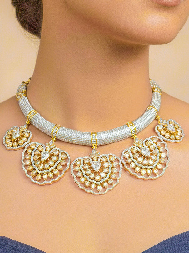 Close-up of a woman wearing an ornate Western American diamond Raizel Necklace Set (Dual Tone) Collar jewellery set and earrings with American Diamond. Bride-to-be styled in a premium American diamond artificial necklace for her reception party.