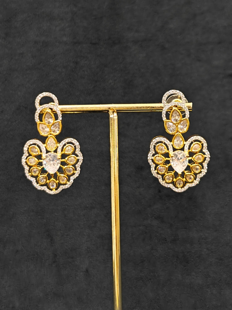  Close-up of an ornate Western American diamond Raizel Necklace Set (Dual Tone) Collar jewellery set and earrings with American Diamond. Bride-to-be styled in a premium American diamond artificial necklace for her reception party.