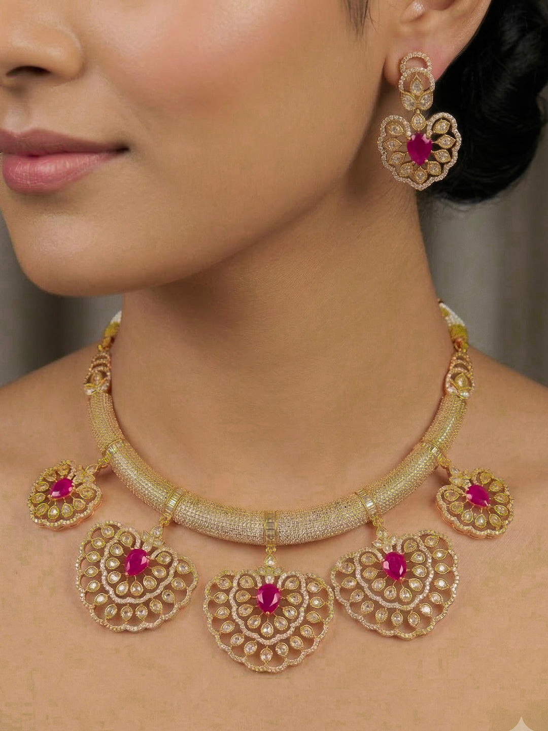 Close-up of a woman wearing an ornate Western American diamond Raizel Ruby Pink Necklace Set (Mehendi Polish) Collar jewellery set and earrings with Colored Stone and American Diamond. Woman styling a statement American diamond necklace with an off-shoulder gown for a reception.