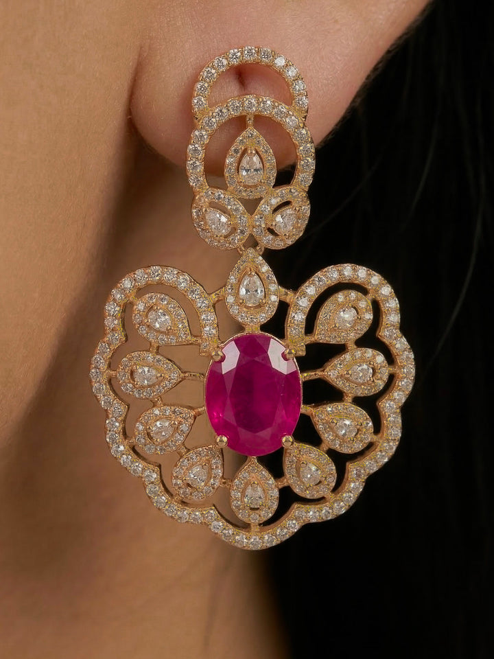 Close-up of a woman wearing an ornate Western American diamond Raizel Ruby Pink Necklace Set (Mehendi Polish) Collar jewellery set and earrings with Colored Stone and American Diamond. Woman styling a statement American diamond necklace with an off-shoulder gown for a reception.
