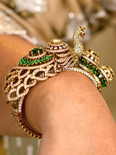 Woman wearing the Rajmor green royal peacock zirconia openable bracelet