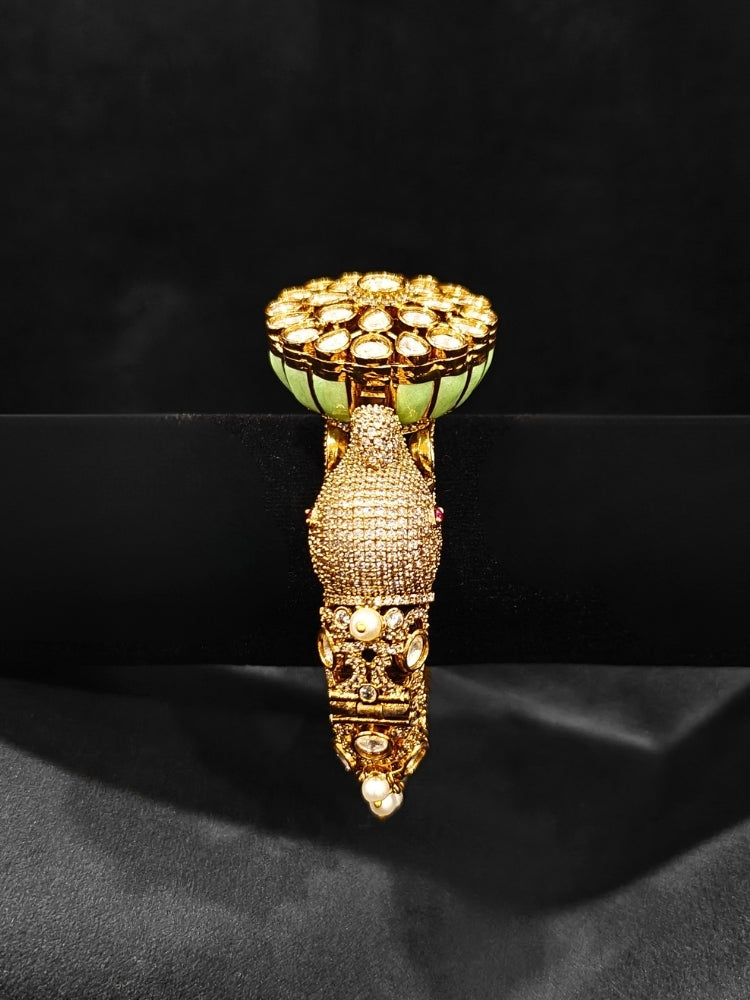 Close-up of an ornate traditional Diamond Mint Green Bracelet with American Diamond, Meenakari and Kundan. Festive Diwali outfit styled with an American diamond artificial Bracelet. Wedding guest wearing a minimal artificial American Diamond bracelet.