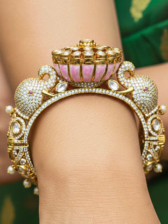 Close-up of a woman wearing an ornate traditional Diamond Mint pink Bracelet with American Diamond, Meenakari and Kundan. Festive Diwali outfit styled with an American diamond artificial Bracelet. Wedding guest wearing a minimal artificial American Diamond bracelet.