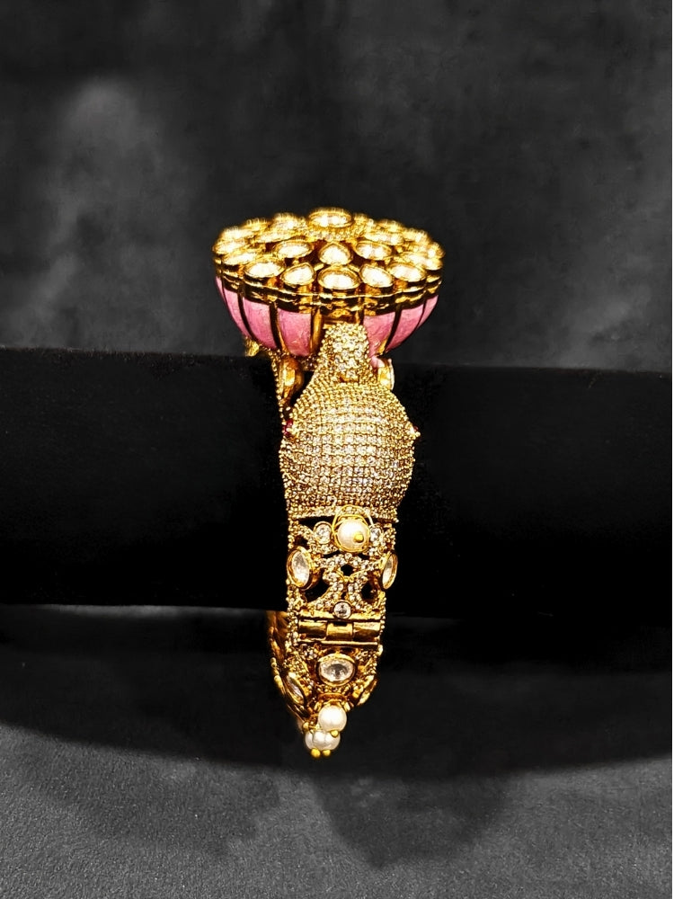 Close-up of an ornate traditional Diamond Mint pink Bracelet with American Diamond, Meenakari and Kundan. Festive Diwali outfit styled with an American diamond artificial Bracelet. Wedding guest wearing a minimal artificial American Diamond bracelet.