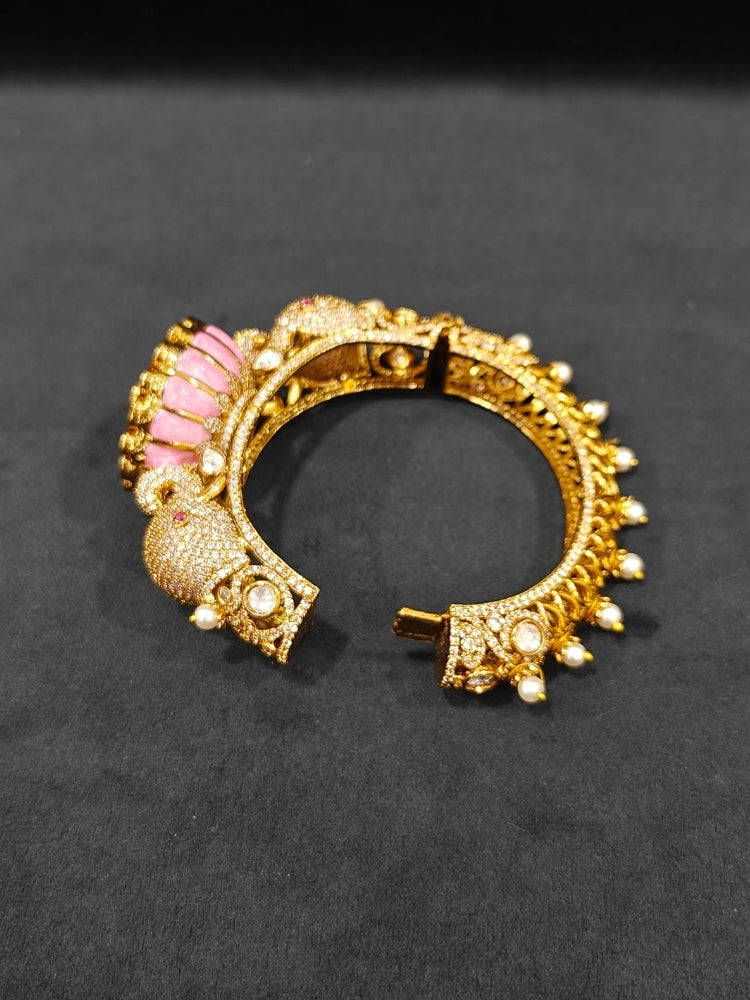 Close-up of an ornate traditional Diamond Mint pink Bracelet with American Diamond, Meenakari and Kundan. Festive Diwali outfit styled with an American diamond artificial Bracelet. Wedding guest wearing a minimal artificial American Diamond bracelet.