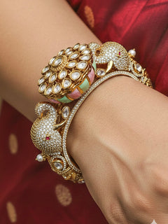 Close-up of a woman wearing an ornate traditional Diamond Mint Green & pink Bracelet with American Diamond, Meenakari and Kundan. Festive Diwali outfit styled with an American diamond artificial Bracelet. Wedding guest wearing a minimal artificial American Diamond bracelet.