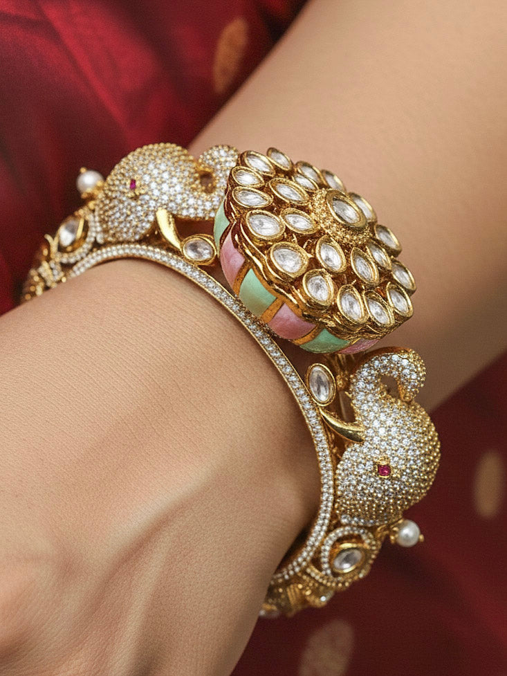 Close-up of a woman wearing an ornate traditional Diamond Mint Green & pink Bracelet with American Diamond, Meenakari and Kundan. Festive Diwali outfit styled with an American diamond artificial Bracelet. Wedding guest wearing a minimal artificial American Diamond bracelet.