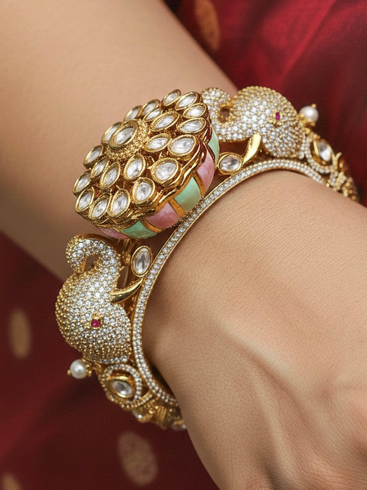 Close-up of a woman wearing an ornate traditional Diamond Mint Green & pink Bracelet with American Diamond, Meenakari and Kundan. Festive Diwali outfit styled with an American diamond artificial Bracelet. Wedding guest wearing a minimal artificial American Diamond bracelet.