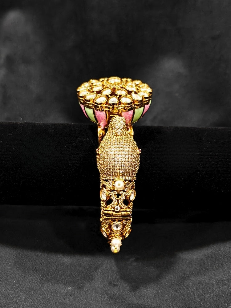 Close-up of an ornate traditional Diamond Mint Green & pink Bracelet with American Diamond, Meenakari and Kundan. Festive Diwali outfit styled with an American diamond artificial Bracelet. Wedding guest wearing a minimal artificial American Diamond bracelet.
