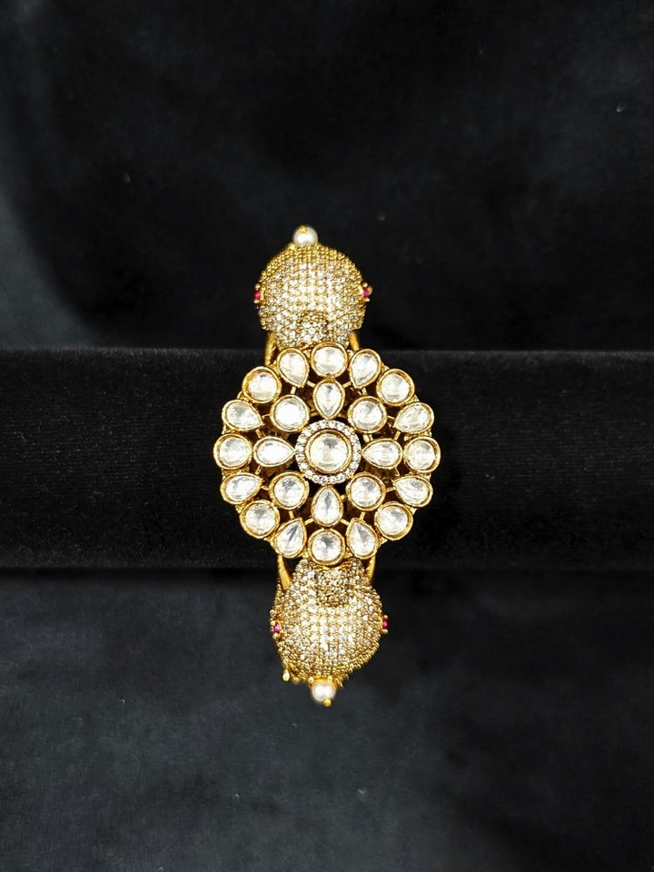 Close-up of an ornate traditional Diamond Mint Green & pink Bracelet with American Diamond, Meenakari and Kundan. Festive Diwali outfit styled with an American diamond artificial Bracelet. Wedding guest wearing a minimal artificial American Diamond bracelet.