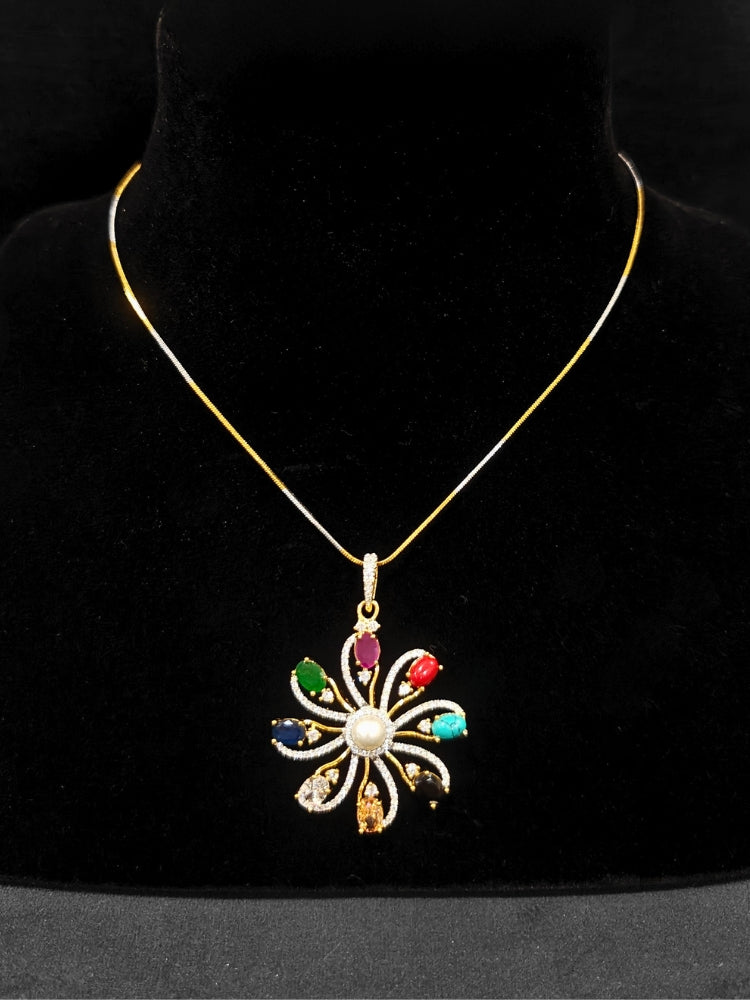 Close-up of an ornate Indo-Western Multi-Color (gold Polish) Pendant set and earrings with American Diamond and Colored Stones. Mehendi function outfit styled with a lightweight American Diamond Pendant. Close-up of high-quality artificial American Diamond Pendant craftsmanship.