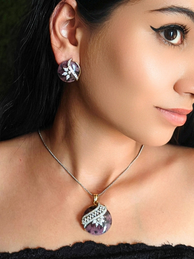 Close-up of a woman wearing an ornate Western Purple Diamond Pendant Set with American Diamons and Purple Colored Stones. Festive Diwali outfit styled with an American diamond artificial Lightweight Pendant Set. Close-up shot of a high-quality American diamond artificial Pendant worn for festive celebrations.