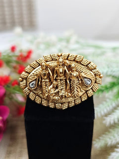 The Ramratan Ring featuring a traditional gold Ring with Goddess Ram, Laxman and sita in the middle, along with Kundan, Bride showcasing a premium temple artificial Ring for wedding rituals. Traditional temple artificial Ring for her South Indian wedding ceremony.