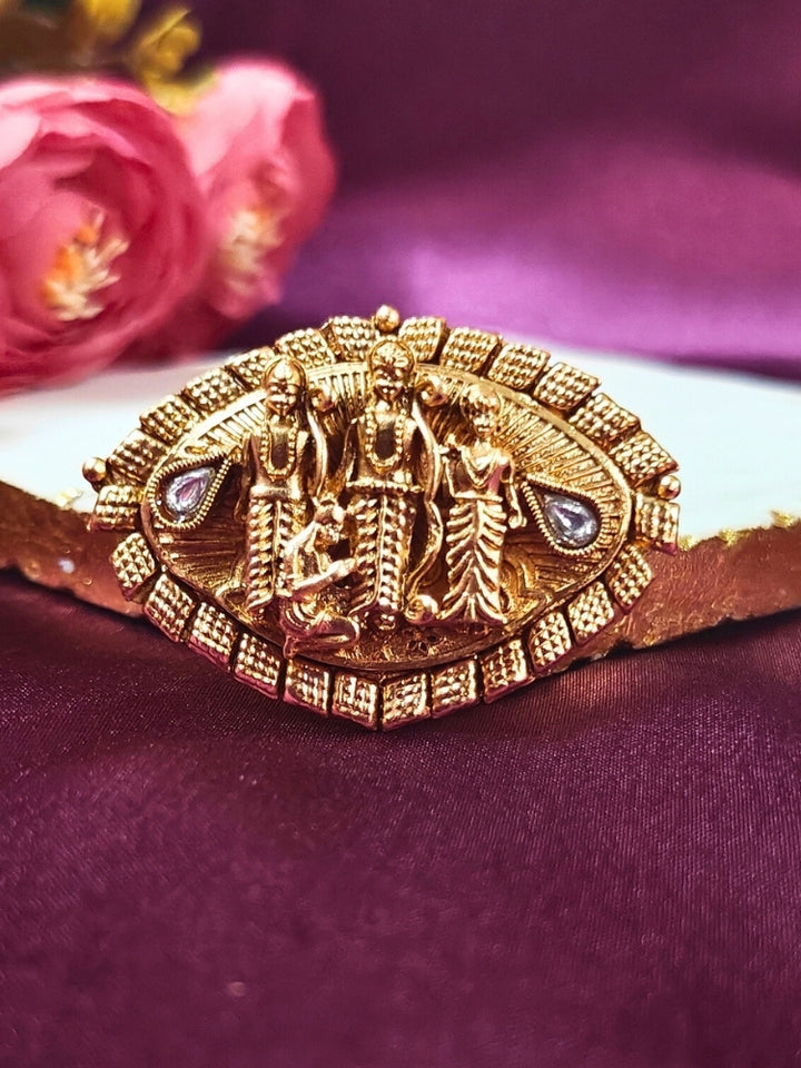 The Ramratan Ring featuring a traditional gold Ring with Goddess Ram, Laxman and sita in the middle, along with Kundan, Bride showcasing a premium temple artificial Ring for wedding rituals. Traditional temple artificial Ring for her South Indian wedding ceremony.