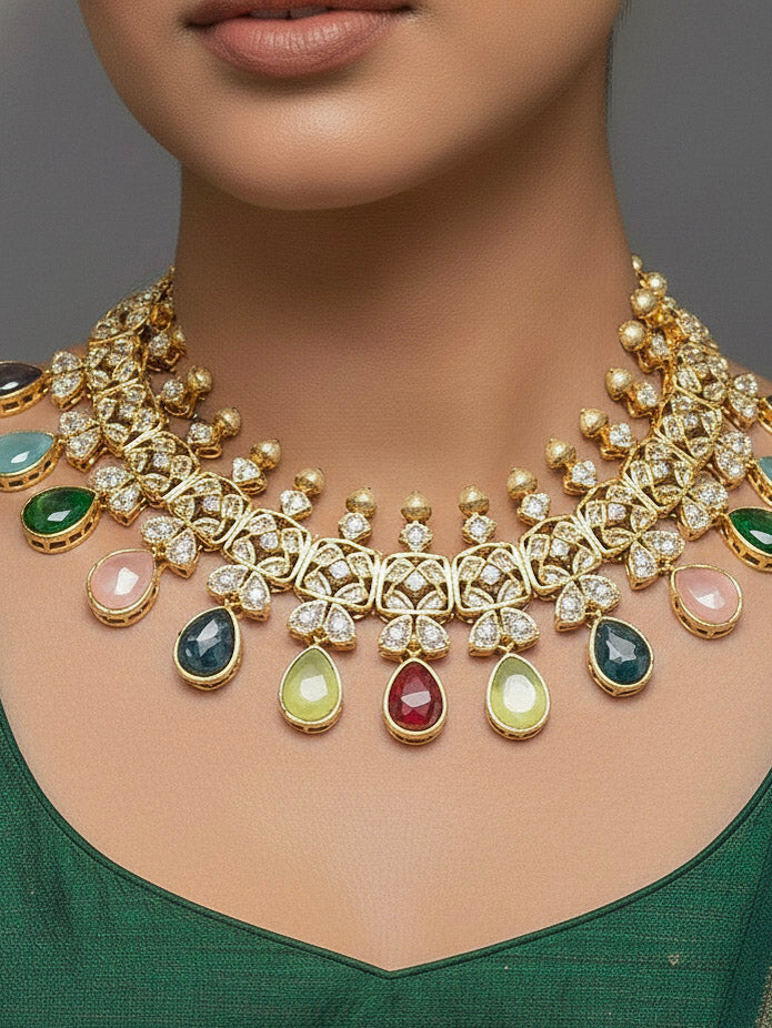 Close-up of a woman wearing an ornate traditional (Gold Polish) Multi-Color Collar jewellery set and earrings with Diamond Polki, Monalisa Stone and Colored Stones. Wedding guest wearing a sparkling American diamond necklace with a saree. A graceful woman wearing a trending American diamond necklace for a 2026 wedding celebration.