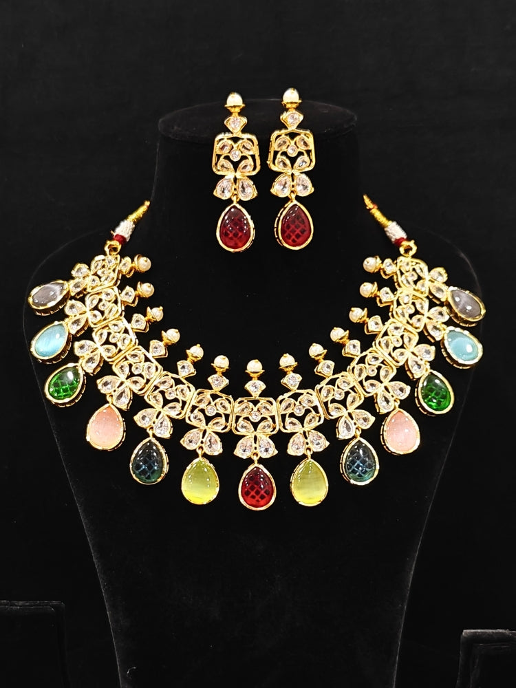 Close-up of an ornate traditional (Gold Polish) Multi-Color Collar jewellery set and earrings with Diamond Polki, Monalisa Stone and Colored Stones. Wedding guest wearing a sparkling American diamond necklace with a saree. A graceful woman wearing a trending American diamond necklace for a 2026 wedding celebration.