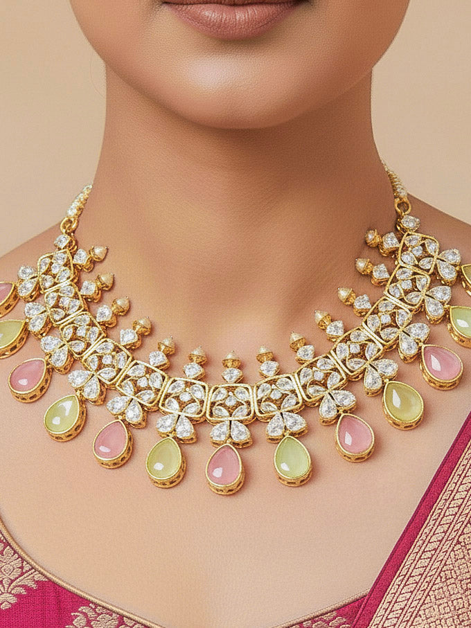Close-up of a woman wearing an ornate traditional (Gold Polish) Pink & Green Collar jewellery set and earrings with Diamond Polki, Monalisa Stone and Colored Stones. Wedding guest wearing a sparkling American diamond necklace with a saree. A graceful woman wearing a trending American diamond necklace for a 2026 wedding celebration.