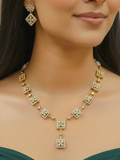 Woman wearing the Ravira gold Y-shaped American Diamond necklace set