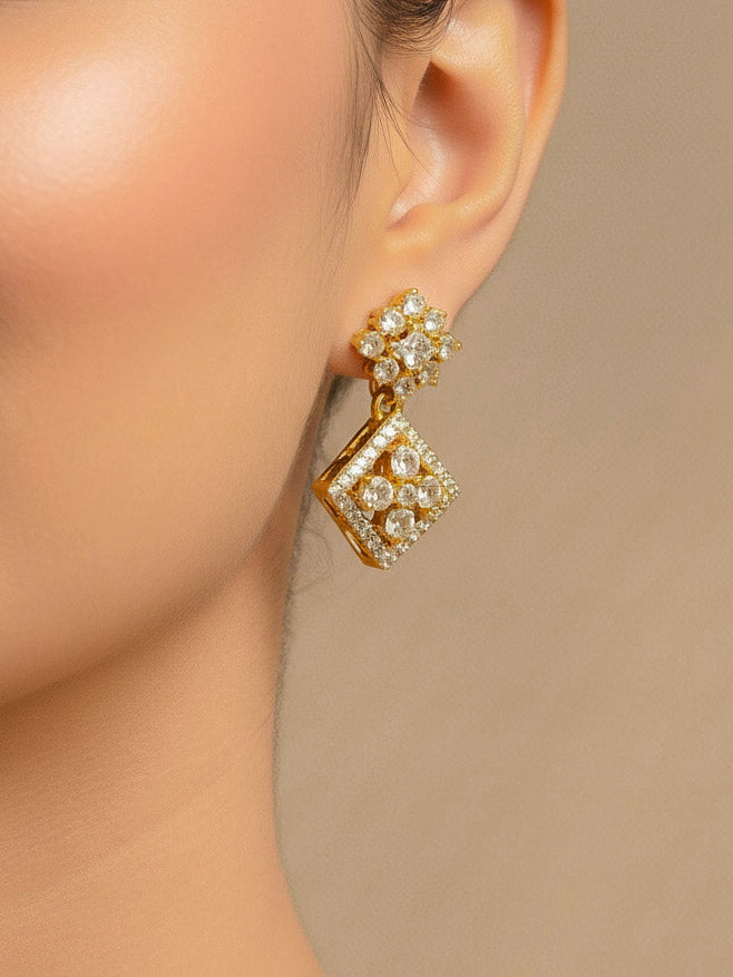 Close-up of a woman wearing an ornate Indo-western (gold Polish) Collar Diamond jewellery set and earrings with American Diamond. Festive Diwali outfit styled with an American diamond artificial necklace. Indo-western outfit styled with a statement American diamond necklace set.