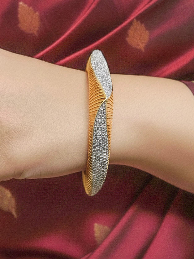 Close-up of a woman wearing an ornate Indo-western Diamond gold Bangles with American Diamond and Filigree work. Woman stacking artificial American Diamond bangles for a festive Diwali celebration. Close-up of sparkling artificial American Diamond bangles for party wear.