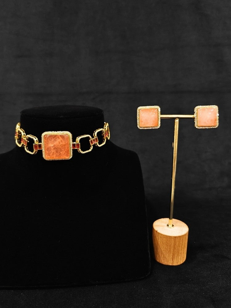 An elegant artificial diamond and peach colored stone choker necklace and matching earrings. This premium artificial diamond jewelry set is perfect for special occasions, from Indian weddings to engagement parties, offering sophisticated glamour without the high price tag.
