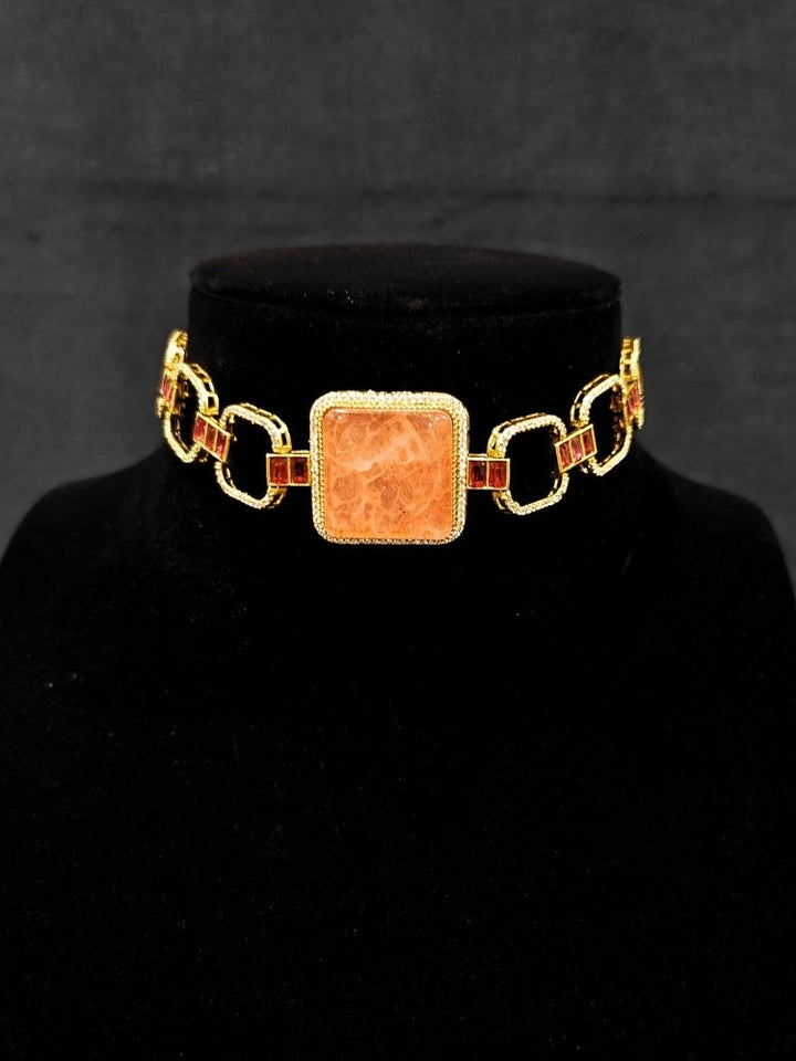 An elegant artificial diamond and peach colored stone choker necklace and matching earrings. This premium artificial diamond jewelry set is perfect for special occasions, from Indian weddings to engagement parties, offering sophisticated glamour without the high price tag.