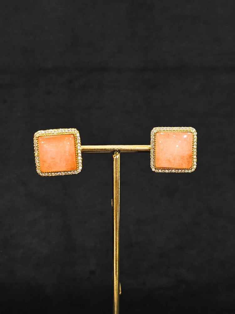 An elegant artificial diamond and peach colored stone choker necklace and matching earrings. This premium artificial diamond jewelry set is perfect for special occasions, from Indian weddings to engagement parties, offering sophisticated glamour without the high price tag.