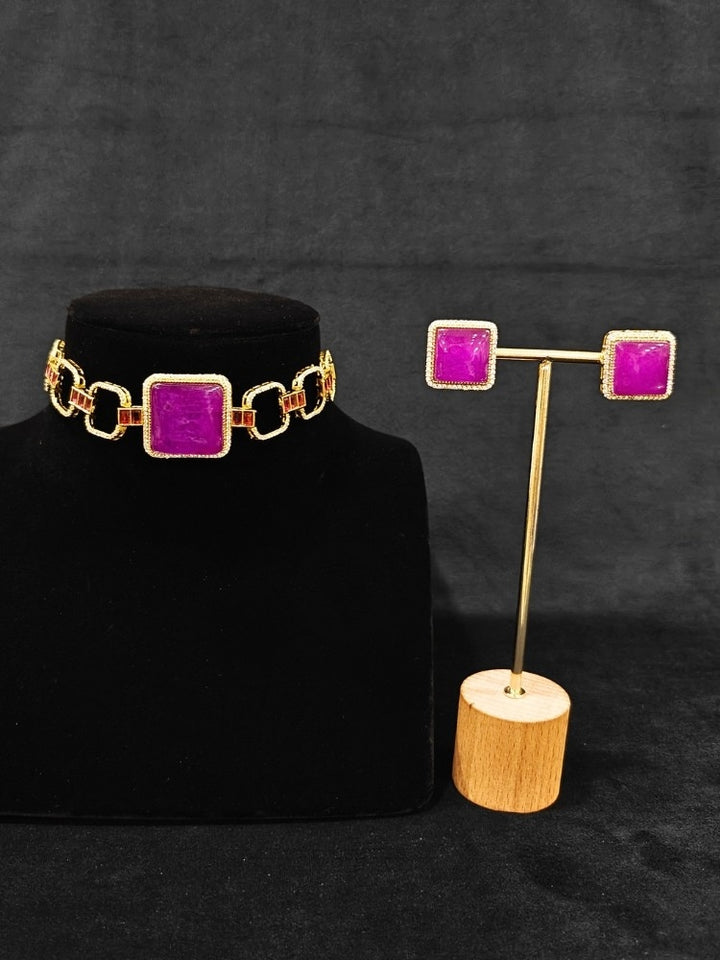 An elegant artificial diamond and purple colored stone choker necklace and matching earrings. This premium artificial diamond jewelry set is perfect for special occasions, from Indian weddings to engagement parties, offering sophisticated glamour without the high price tag.