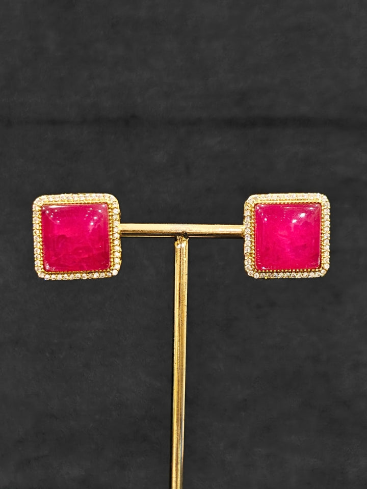 A luxurious artificial diamond and rani pink colored stone choker necklace with matching earrings, perfect for high-profile wedding receptions and formal galas. This high-end artificial diamond jewelry set combines style, elegance, and affordability for special occasions.