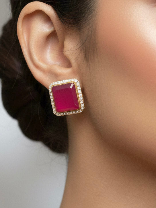 "Close-up of a model in luxurious artificial diamond jewelry featuring a designer diamond and rani pink colored stone choker necklace and earrings set, crafted for bridal fashion and high-end weddings. This beautiful diamond jewelry set offers the brilliance of real diamonds at an affordable price."