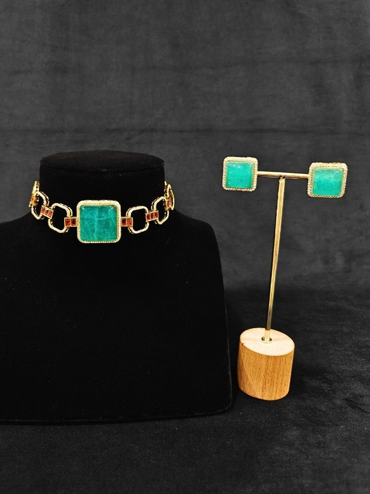 An elegant artificial diamond and sea green colored stone choker necklace and matching earrings. This premium artificial diamond jewelry set is perfect for special occasions, from Indian weddings to engagement parties, offering sophisticated glamour without the high price tag.