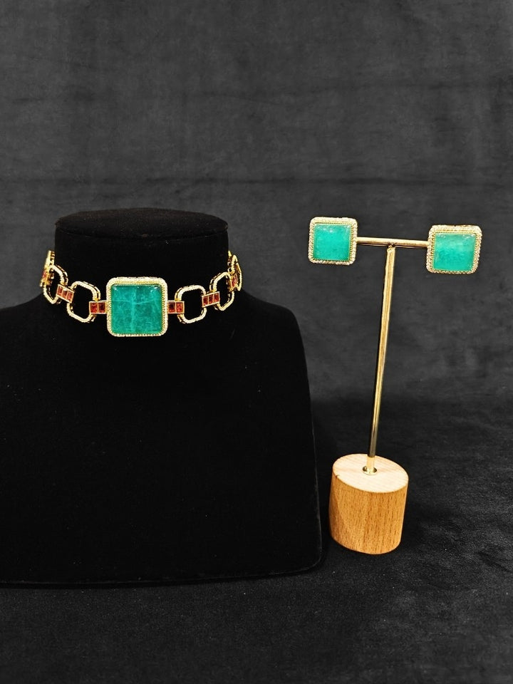 An elegant artificial diamond and sea green colored stone choker necklace and matching earrings. This premium artificial diamond jewelry set is perfect for special occasions, from Indian weddings to engagement parties, offering sophisticated glamour without the high price tag.