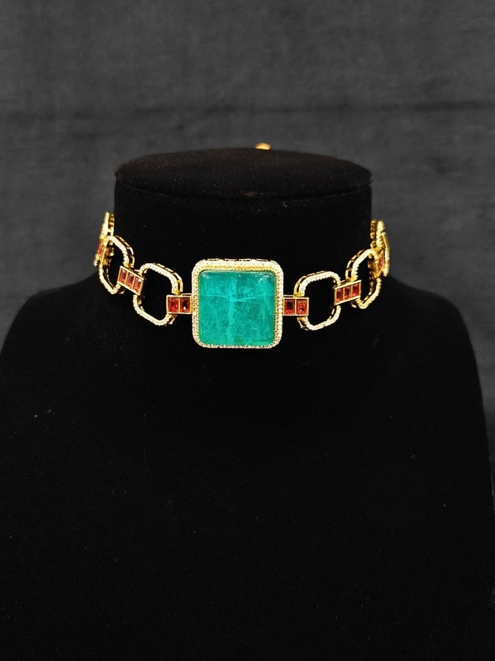 An elegant artificial diamond and sea green colored stone choker necklace and matching earrings. This premium artificial diamond jewelry set is perfect for special occasions, from Indian weddings to engagement parties, offering sophisticated glamour without the high price tag.