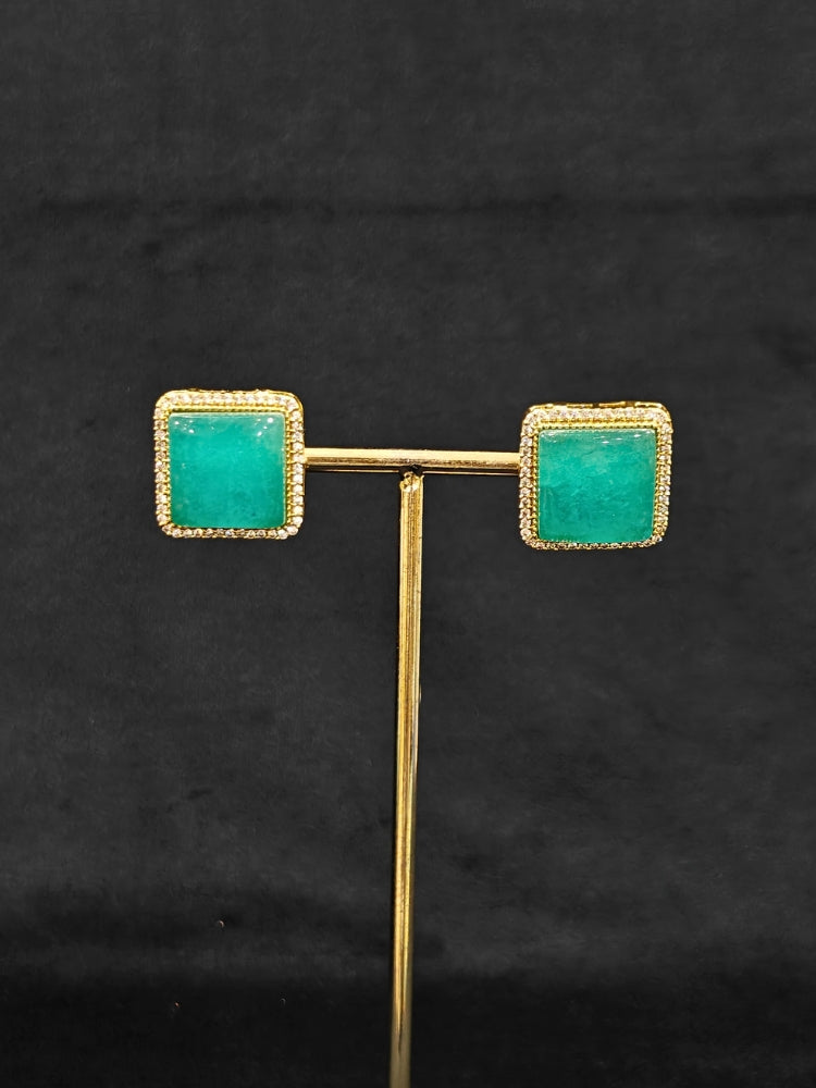 An elegant artificial diamond and sea green colored stone choker necklace and matching earrings. This premium artificial diamond jewelry set is perfect for special occasions, from Indian weddings to engagement parties, offering sophisticated glamour without the high price tag.