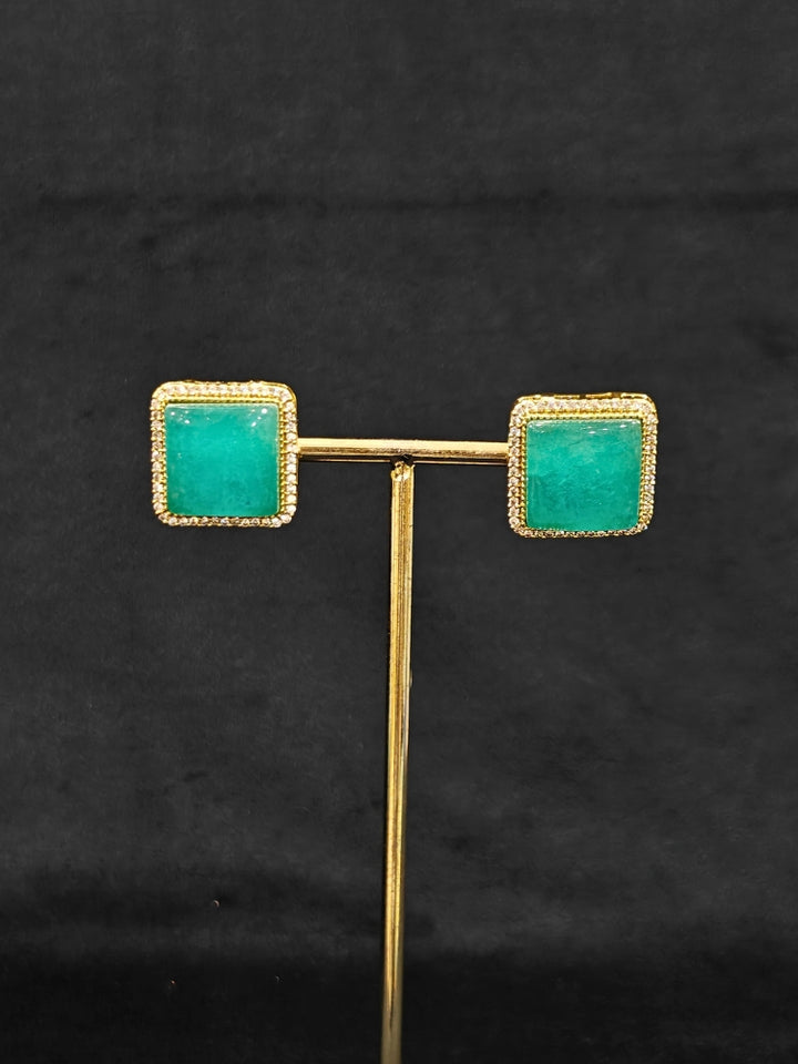 An elegant artificial diamond and sea green colored stone choker necklace and matching earrings. This premium artificial diamond jewelry set is perfect for special occasions, from Indian weddings to engagement parties, offering sophisticated glamour without the high price tag.