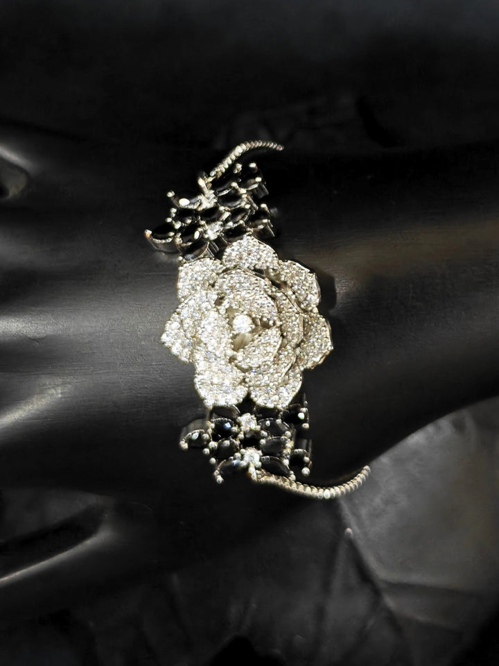 Close-up of an ornate  Indo-western Black Silver Collar American Diamond jewellery set, earrings, maangtikka, Ring and Bracelet with Black Colored Stones and American Diamond. A graceful trending American diamond necklace for a 2026 wedding celebration.