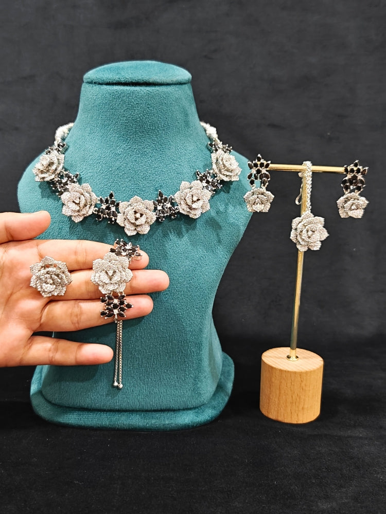 Close-up of an ornate  Indo-western Black Silver Collar American Diamond jewellery set, earrings, maangtikka, Ring and Bracelet with Black Colored Stones and American Diamond. A graceful trending American diamond necklace for a 2026 wedding celebration.