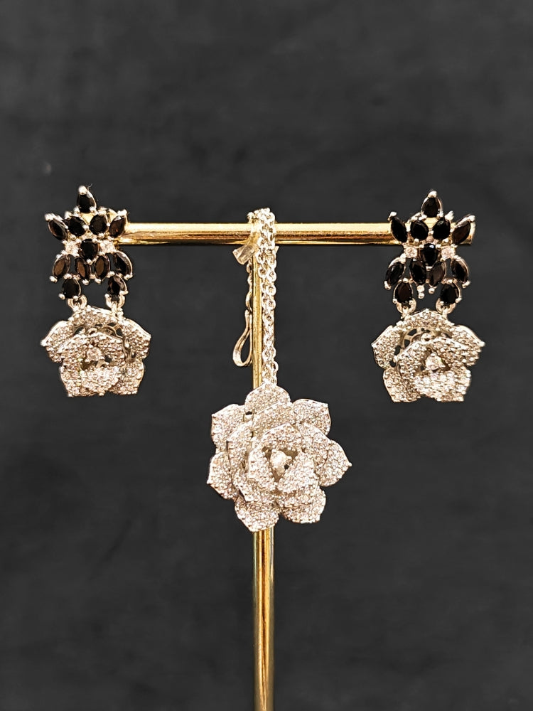 Close-up of an ornate  Indo-western Black Silver Collar American Diamond jewellery set, earrings, maangtikka, Ring and Bracelet with Black Colored Stones and American Diamond. A graceful trending American diamond necklace for a 2026 wedding celebration.