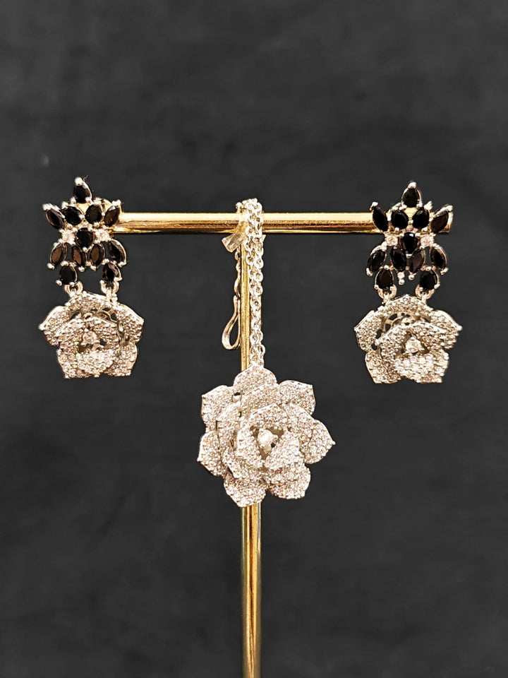 Close-up of an ornate  Indo-western Black Silver Collar American Diamond jewellery set, earrings, maangtikka, Ring and Bracelet with Black Colored Stones and American Diamond. A graceful trending American diamond necklace for a 2026 wedding celebration.